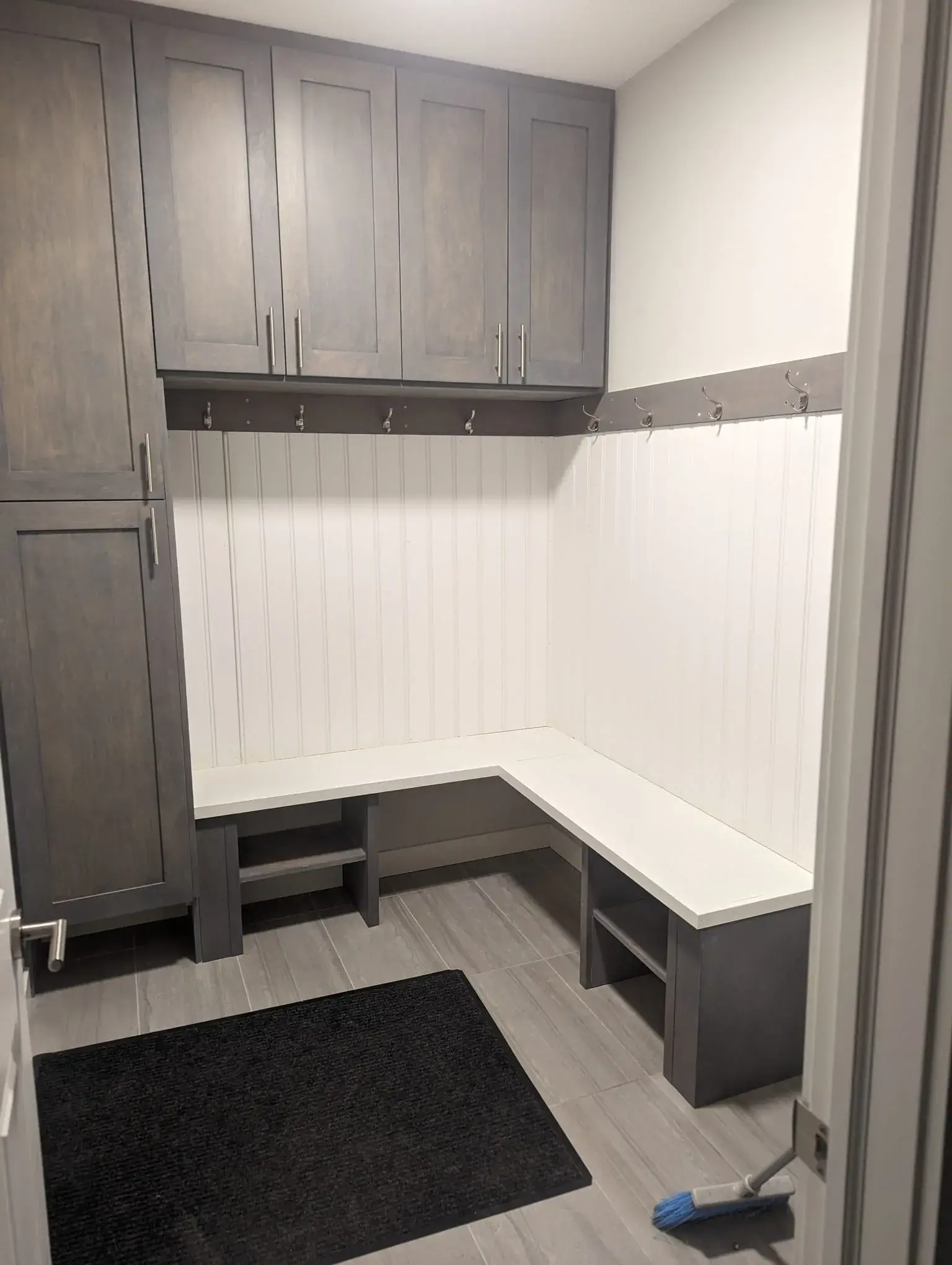 Mudroom with bench and storage cabinets