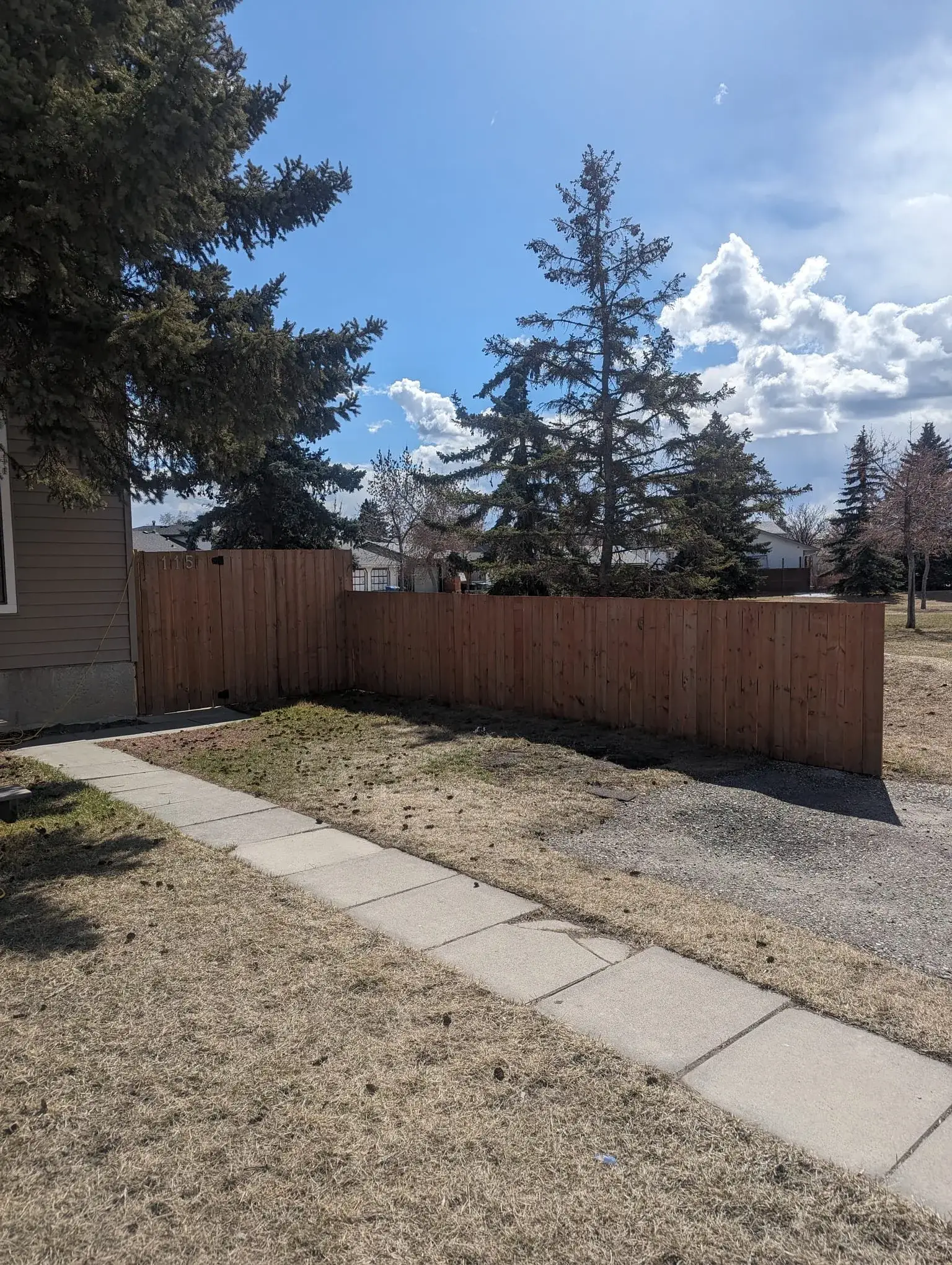 New wood privacy fence installed in a Calgary backyard